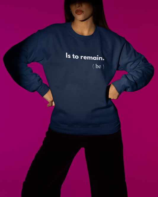Sudadera azul marino con frase pequeña Is to remain estampada en blanco.